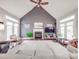 Sun-filled living room with a vaulted ceiling, a fireplace, and bright French doors at 4032 River Falls Dr, Lowell, NC 28098