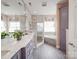 A luxurious main bathroom featuring a double vanity, glass shower, and soaking tub at 4032 River Falls Dr, Lowell, NC 28098