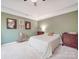 A beautifully decorated main bedroom with warm neutral tones and plenty of natural light at 4032 River Falls Dr, Lowell, NC 28098