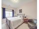Relaxing main bedroom with a comfy chair and ample natural light at 4032 River Falls Dr, Lowell, NC 28098