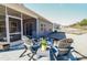 View of the backyard and patio with Adirondack chairs surrounding a modern firepit, perfect for outdoor relaxation at 4321 Duplin Dr, Charlotte, NC 28214