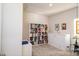 A bedroom with a large bookcase and a wall bed at 4321 Duplin Dr, Charlotte, NC 28214