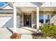Inviting front porch showcasing stone accents, stylish seating, and the home's address number at 4321 Duplin Dr, Charlotte, NC 28214