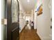 Elegant hallway featuring hardwood floors, stylish decor, and a view into the dining area at 4321 Duplin Dr, Charlotte, NC 28214