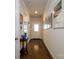 Inviting hallway showcasing hardwood floors, neutral paint, and a glimpse of the front door at 4321 Duplin Dr, Charlotte, NC 28214