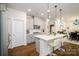 Modern kitchen featuring gray cabinets, stainless steel appliances, and a stylish island with seating at 4321 Duplin Dr, Charlotte, NC 28214
