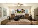 Bright living room with hardwood floors, a ceiling fan, and a cozy seating area at 4321 Duplin Dr, Charlotte, NC 28214