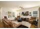 Spacious living room with hardwood floors, ceiling fan, and comfortable seating arrangement at 4321 Duplin Dr, Charlotte, NC 28214