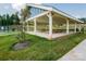 A spacious picnic shelter provides ample seating for gatherings and overlooks green space and a tennis court at 4321 Duplin Dr, Charlotte, NC 28214