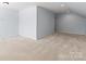 Attic features recessed lighting, light walls, and neutral carpet at 4329 Hunton Dale Nw Rd, Concord, NC 28027