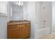 Bathroom features vanity with granite counters, framed mirror, and shower over tub combo at 4329 Hunton Dale Nw Rd, Concord, NC 28027