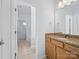 Bathroom features vanity with granite counters, framed mirror, and tile floors at 4329 Hunton Dale Nw Rd, Concord, NC 28027