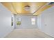 Bright bedroom with tray ceiling, chandelier and two windows offers natural light at 4329 Hunton Dale Nw Rd, Concord, NC 28027