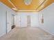 A serene bedroom boasting a tray ceiling and neutral tones, flooded with natural light at 4329 Hunton Dale Nw Rd, Concord, NC 28027
