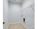 Walk-in closet with tile floors, shelving, and electrical outlet at 4329 Hunton Dale Nw Rd, Concord, NC 28027
