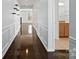 Hallway with dark hardwood floors, paneled walls, and natural light at 4329 Hunton Dale Nw Rd, Concord, NC 28027