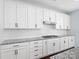Modern kitchen featuring white cabinets, subway tile backsplash, and granite countertops at 4329 Hunton Dale Nw Rd, Concord, NC 28027