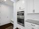 Modern kitchen with built-in stainless steel oven and microwave at 4329 Hunton Dale Nw Rd, Concord, NC 28027