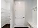Mudroom with coat hooks, bench, and door to storage at 4329 Hunton Dale Nw Rd, Concord, NC 28027