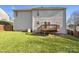 Backyard featuring a wooden deck and a spacious lawn at 4910 Summerside Dr, Clover, SC 29710