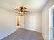 Neutral bedroom featuring a ceiling fan, carpet, and two closets, with a glimpse into an adjacent room at 4910 Summerside Dr, Clover, SC 29710