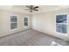 Large main bedroom featuring a tray ceiling and natural light from two windows at 4910 Summerside Dr, Clover, SC 29710