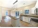 Kitchen island and stainless steel appliances in open concept kitchen at 4910 Summerside Dr, Clover, SC 29710
