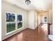 Sun-filled living room featuring hardwood floors and large windows at 4910 Summerside Dr, Clover, SC 29710