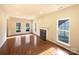 Spacious living room with fireplace and abundant natural light from large windows at 4910 Summerside Dr, Clover, SC 29710