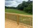 An expansive green lawn view from a wooden deck highlights the outdoor space of this property at 514 Eagle Mills Rd # 3, Hamptonville, NC 27020