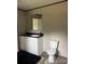 Well-lit bathroom featuring a modern vanity and commode at 514 Eagle Mills Rd # 3, Hamptonville, NC 27020