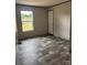 Bedroom with wood-look floors and a door and a window at 514 Eagle Mills Rd # 3, Hamptonville, NC 27020