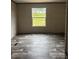 Spacious bedroom with wood-look floors and natural light from window at 514 Eagle Mills Rd # 3, Hamptonville, NC 27020