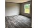 Bedroom featuring wood-look floors and natural light at 514 Eagle Mills Rd # 3, Hamptonville, NC 27020