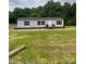 Charming single-story home featuring a well-manicured lawn and inviting front porch at 514 Eagle Mills Rd # 3, Hamptonville, NC 27020
