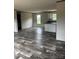 Open-concept living area featuring luxury vinyl plank flooring and neutral paint at 514 Eagle Mills Rd # 3, Hamptonville, NC 27020