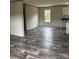 Open-concept living area featuring luxury vinyl plank flooring and neutral paint at 514 Eagle Mills Rd # 3, Hamptonville, NC 27020