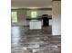 Open concept living area into kitchen with eat at bar and luxury vinyl plank flooring at 514 Eagle Mills Rd # 3, Hamptonville, NC 27020