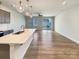 Modern kitchen and living area with hardwood floors and stainless steel appliances at 5629 Axil Ln, Charlotte, NC 28269