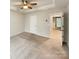 Spacious main bedroom with neutral carpet, ceiling fan, and tray ceilings at 5629 Axil Ln, Charlotte, NC 28269