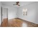 Bedroom with hardwood floors, a ceiling fan and a window with a view of the outside at 5825 Ruth Dr, Charlotte, NC 28215