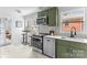 Modern kitchen with an eat-in island, stainless appliances, and trendy tiled floors at 5825 Ruth Dr, Charlotte, NC 28215