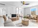 Bright living room with hardwood floors, a modern ceiling fan, and stylish furnishings at 5825 Ruth Dr, Charlotte, NC 28215