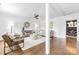 Open-concept living room with modern decor, hardwood floors, and a neutral color palette at 5825 Ruth Dr, Charlotte, NC 28215