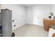 Bright utility room with patterned tile flooring and white walls at 5825 Ruth Dr, Charlotte, NC 28215