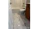 Bathroom featuring marble tile flooring, tub, and modern fixtures at 6044 Great Basin Ln, Fort Mill, SC 29707