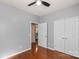 A bedroom with hardwood floors, a ceiling fan and two closets at 6044 Great Basin Ln, Fort Mill, SC 29707