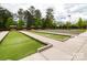 Outdoor bocce ball courts with shelters, benches, and well-manicured landscaping at 6044 Great Basin Ln, Fort Mill, SC 29707
