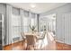 Bright dining area features large windows with views, hardwood flooring, and white trim at 6044 Great Basin Ln, Fort Mill, SC 29707