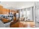 Bright eat-in kitchen features stainless appliances, wood cabinets, and dining area with natural light at 6044 Great Basin Ln, Fort Mill, SC 29707